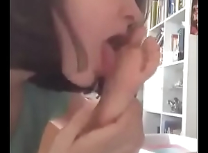 Cute teen licking and sucking her foot